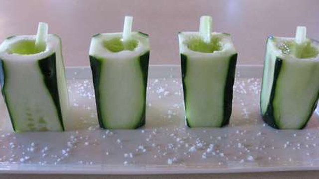 Cucumbers carved into shot glasses