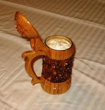 Wassail served in a stein topped with whipped cream