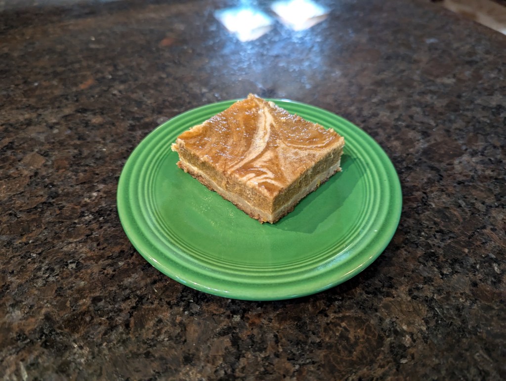 Pumpkin cheesecake bar served on a fiesta plate