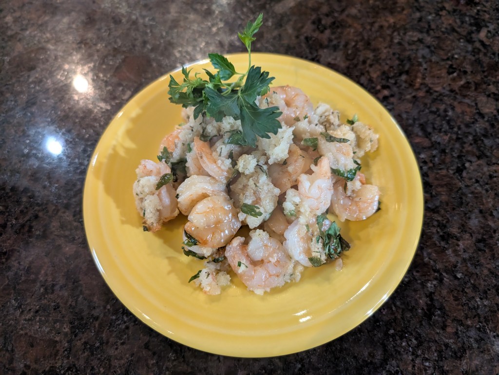 Shrimps de Jongle served with some parsley because when I spooned it onto the plate, I said, "I'm not sure I can make this pretty," and my spouse stuck the sprig of parsley on top. And now of course it's pretty.
