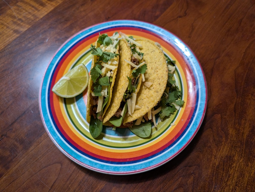 teriyaki turkey tacos with a wedge of lime