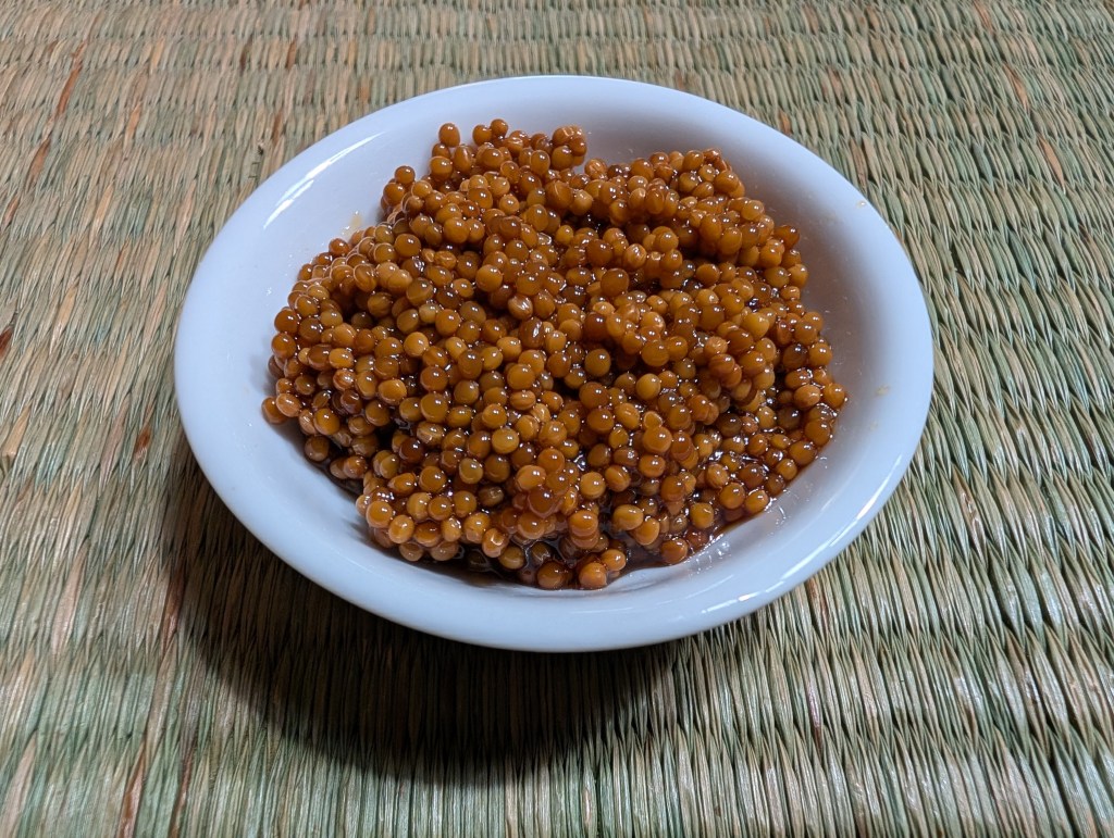 close-up of pickled mustard seeds in a tiny bowl
