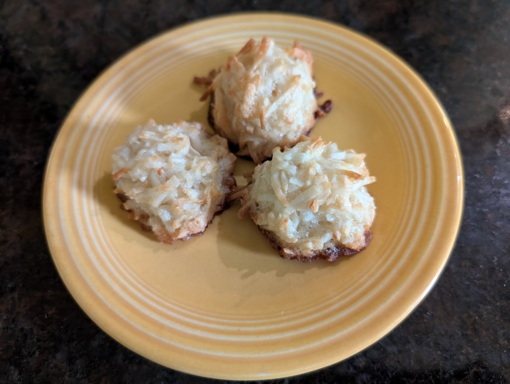 Three macaroons on a small saucer. This is the size you get with a small cookie scoop.