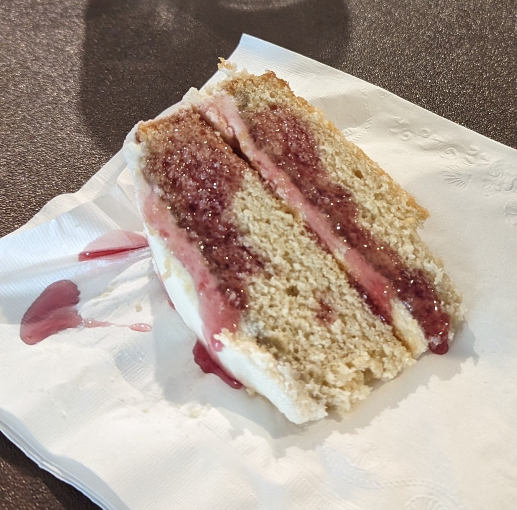 A slice of blueberry sekanjabin cake drizzled with extra sekanjabin