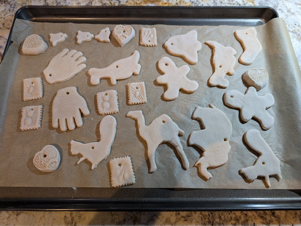 Bread dough ornaments after baking, still on the baking sheet