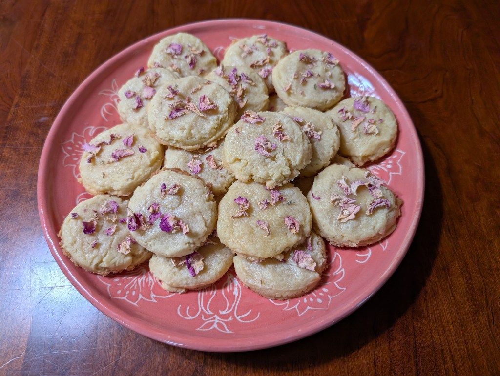 One batch of rose cakes on a pink ceramic plate
