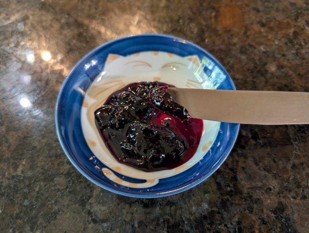 blueberry lemon jam in a little saucer with a knife