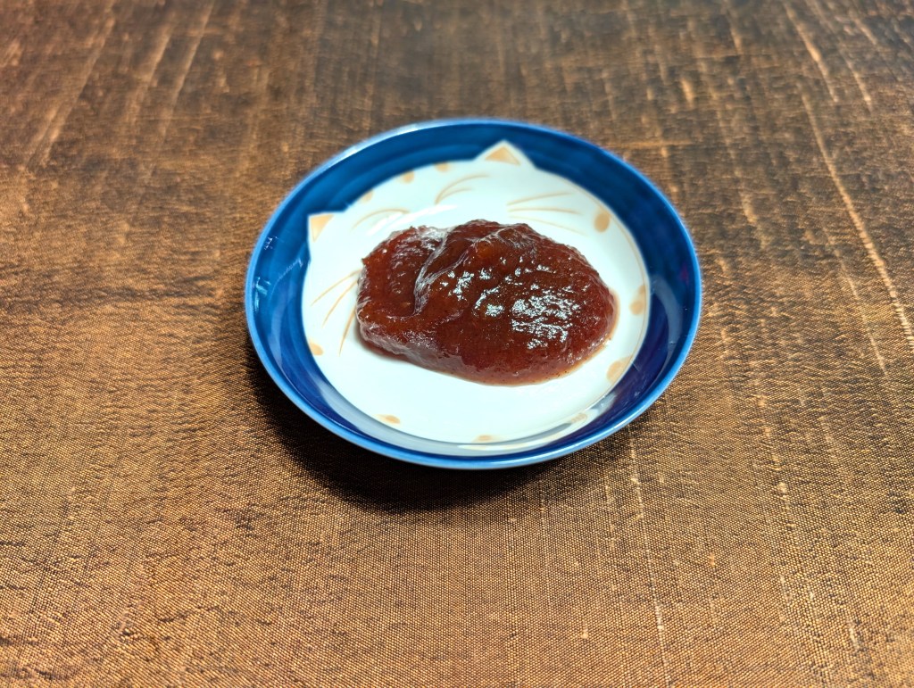 A dollop of apple butter in a small saucer