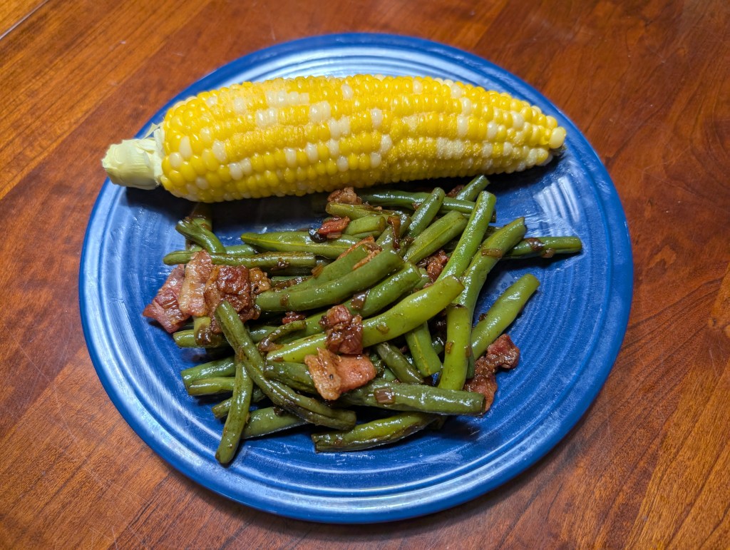 Green beans and bacon with corn on the cob