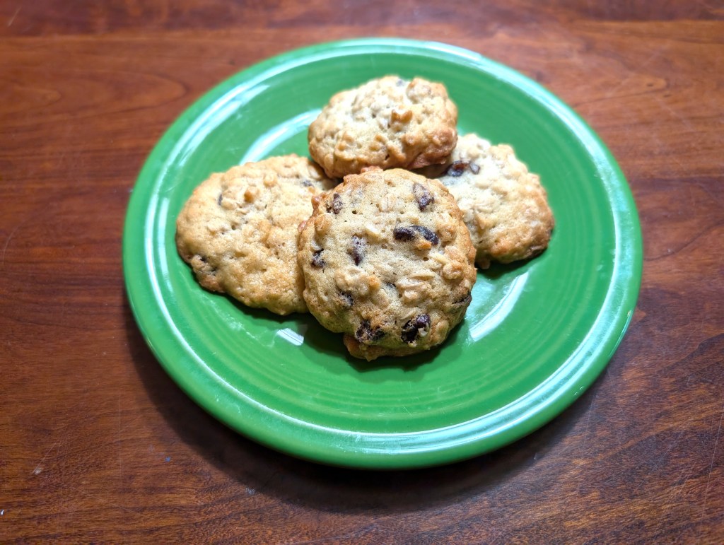 four oatmeal raisin cookies on a plate