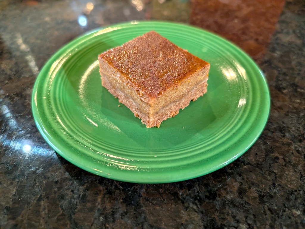 pumpkin bar cut into a square and served on a small plate