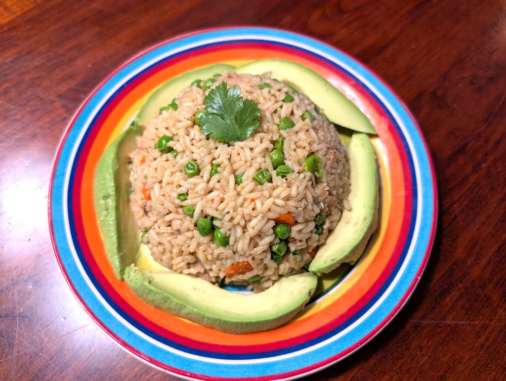 Pulao served with avocado because it was going to go bad if we didn't eat it